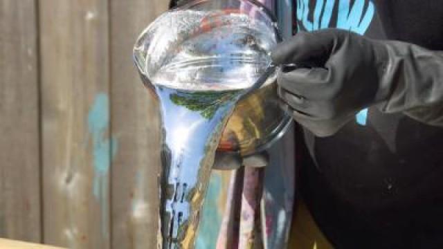 Pouring a Liquid Mirror in Slow Motion