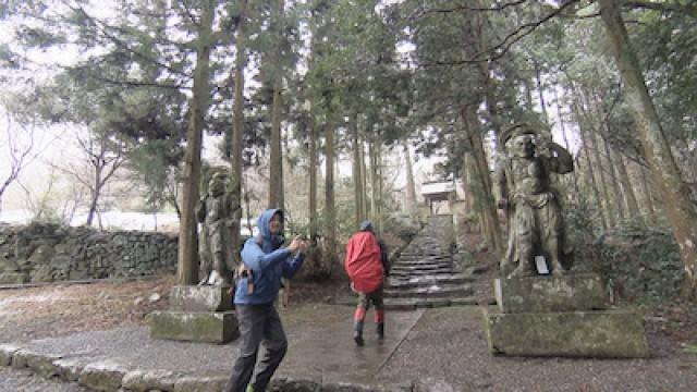 A Mountainous Pilgrimage of Stone Buddhist Statues & A Town Draped in Curtains