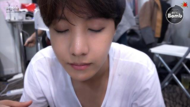 j-hope is trying to wear contact lenses.