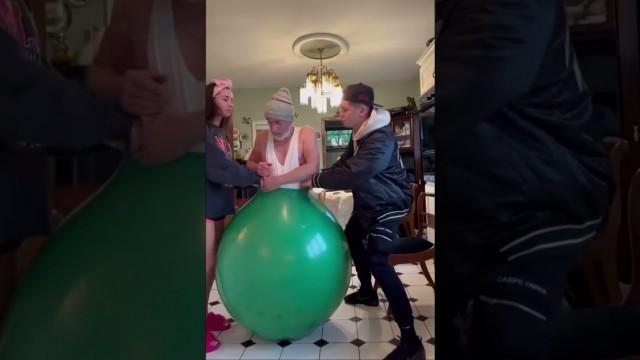 Shoving Dad into a Balloon