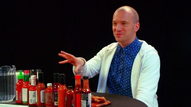 Superfan Brett Baker Grills Sean Evans Over Spicy Wings