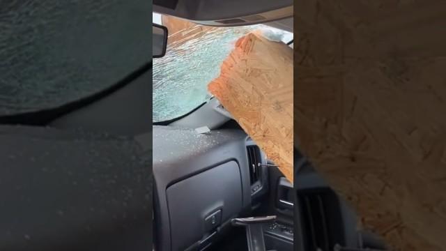 Wooden Board Crashes Through Windshield
